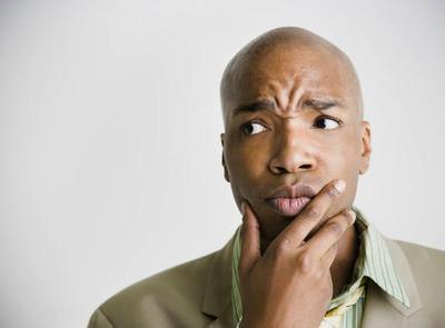 c4c7b-confused-black-man-green-shirt-400x295