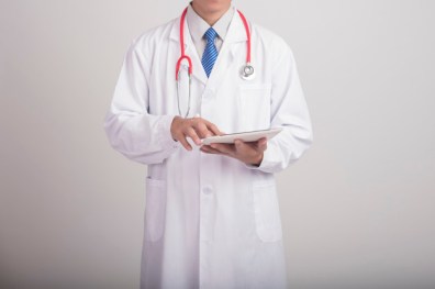 Medicine doctor hand holding stethoscope and working with modern